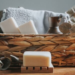 Charming basket of handcrafted soaps and eucalyptus branches for a serene bathroom aesthetic.