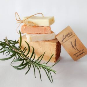 Stacked artisanal soaps with rosemary and lavender, showcasing natural skincare.