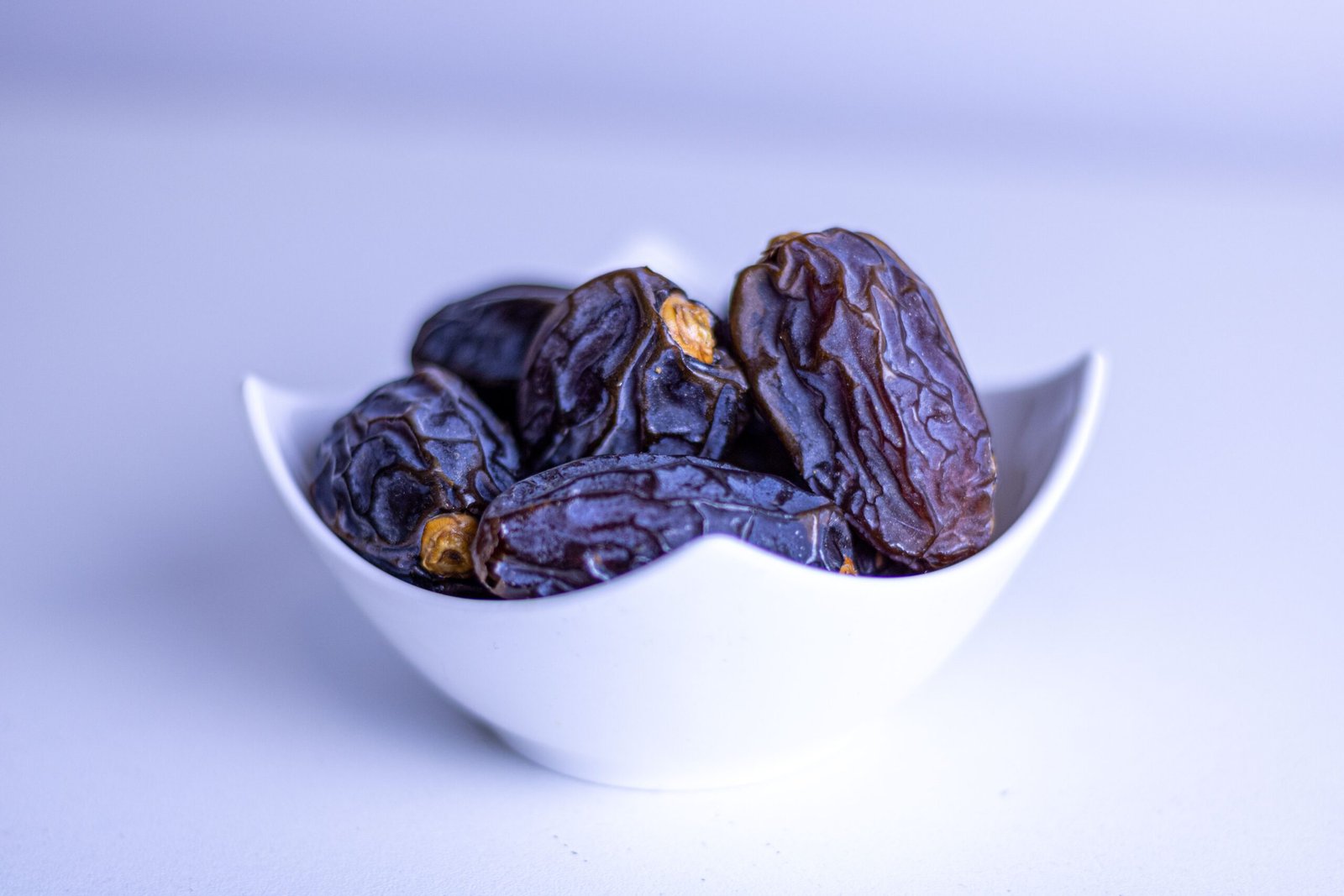 pexels photo 6200512 6200512 A close-up of fresh dates in a decorative white bowl, symbolizing Ramadan.